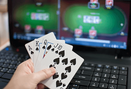Top Online Blackjack Games Top Online Blackjack Games - Picture of Hand Holding Cards in Front of Laptop